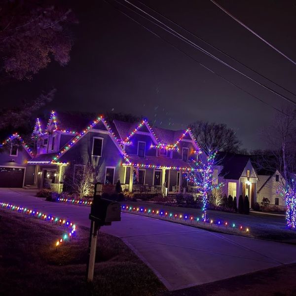 Festively decorated home by Holiday Prestige, featuring vibrant holiday lights and outdoor décor for a dazzling seasonal display.